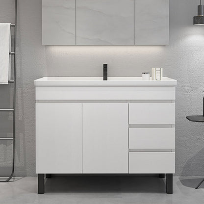 Bathroom vanity with white countertop and cabinets in a modern bathroom setting.