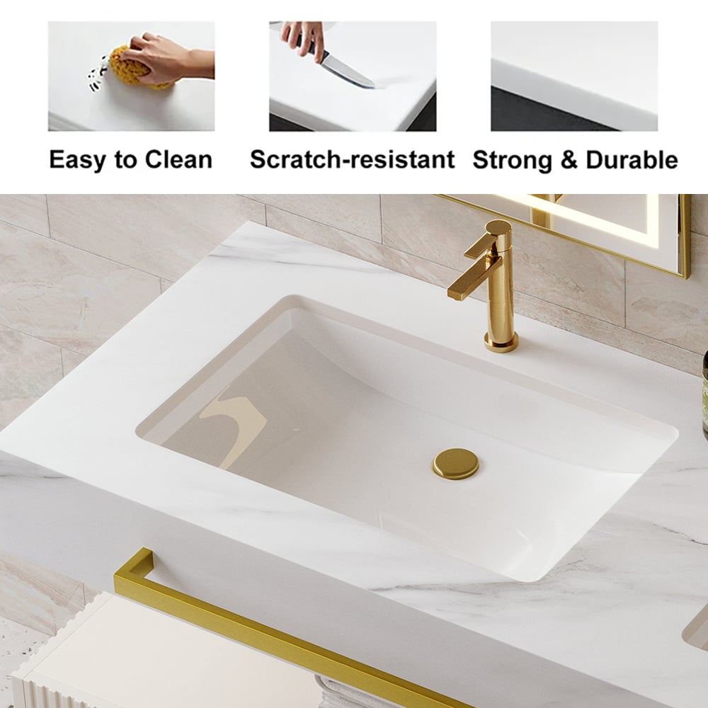White sink with gold faucet and accessories in a bathroom setting