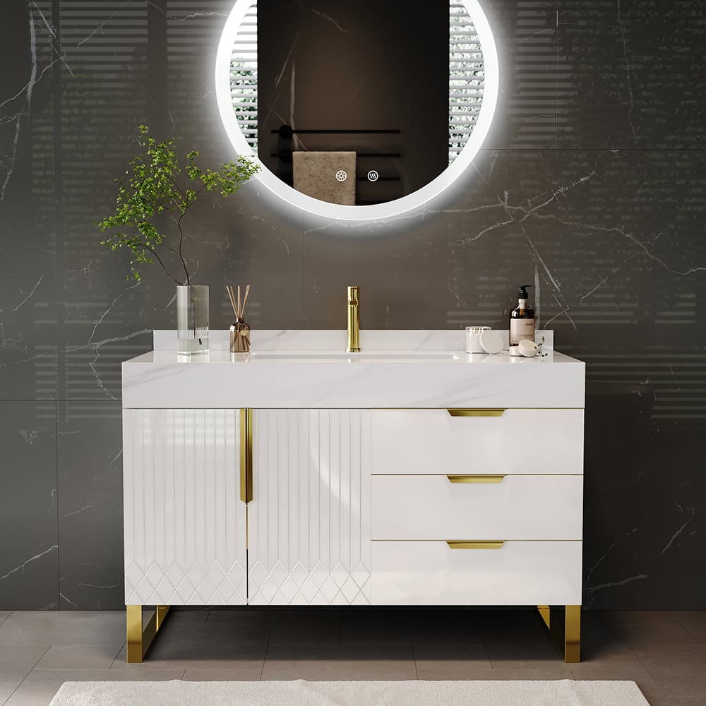 Bathroom vanity with white countertop, gold fixtures, and round mirror on a dark wall.